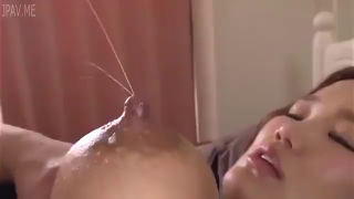 Asian Lady Squeezes Milk Off Her Breast